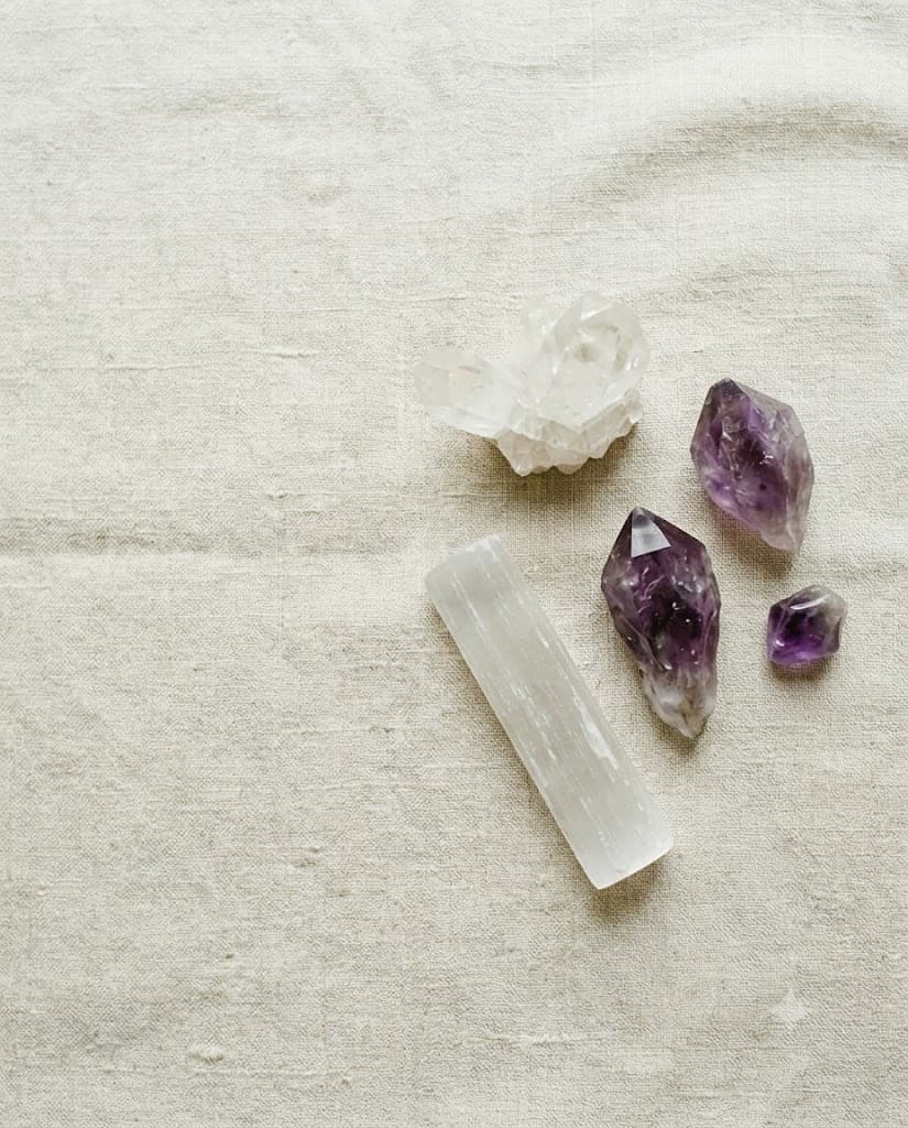Amethyst, selenite and clear quartz on bone linen