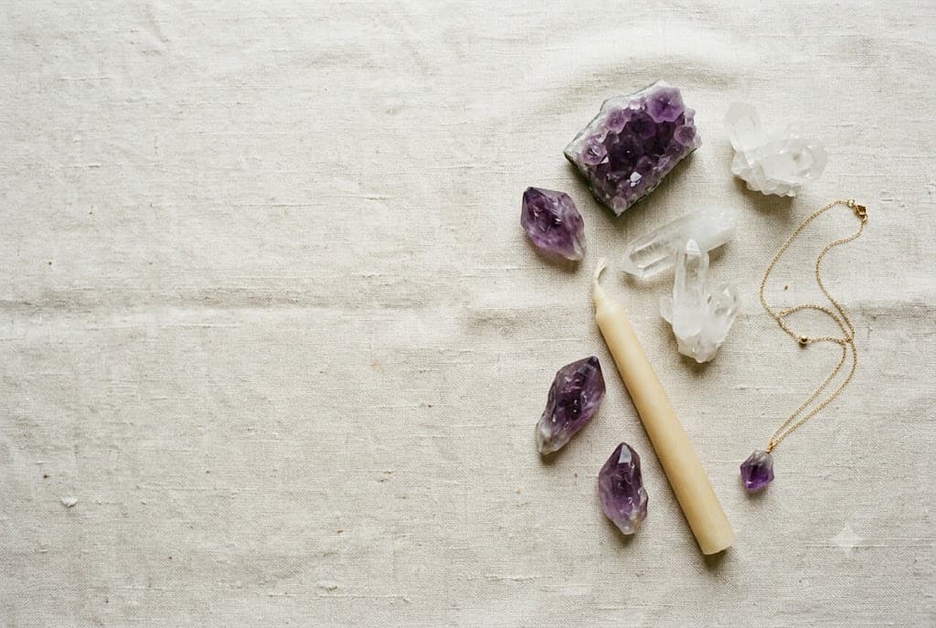 A considered edit of crystals, a bone candle and fine jewellery on linen
