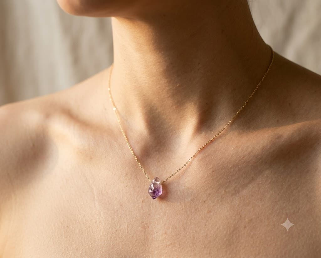 A single crystal on a slip of gold-fill chain, worn close